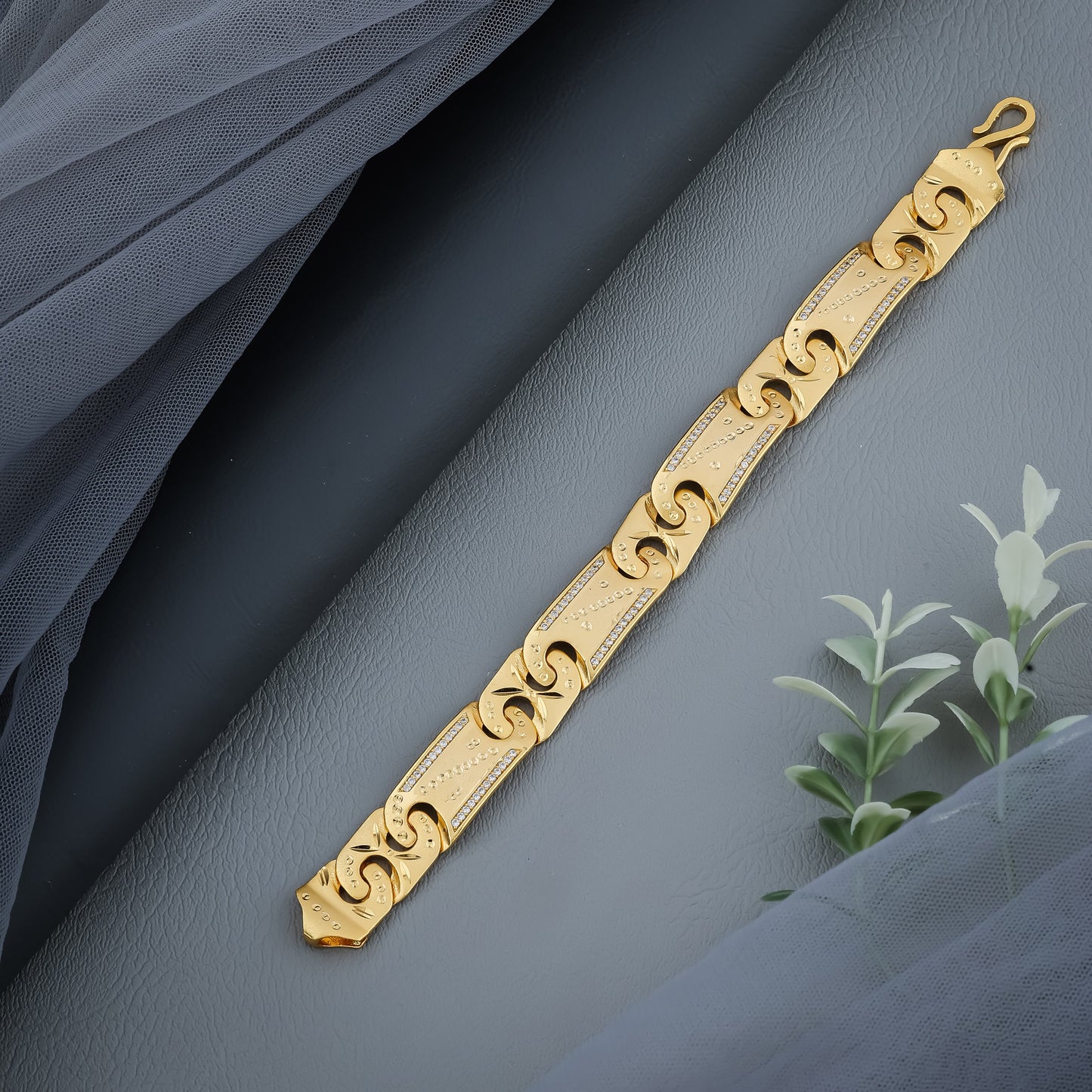 Regal Wave-Link Gold Bracelet with Intricate Stone Detailing