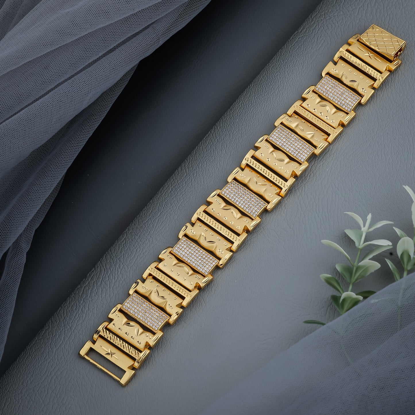 Bold Gold Plated Bracelet with Textured Panels and Diamond-Like Inlays"