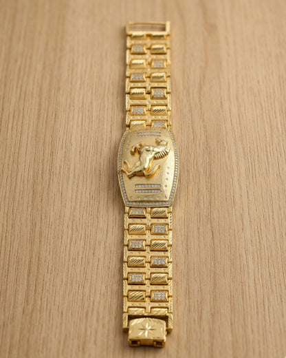 Gold Plated Bracelet with Embossed Horse Motif and Diamond-Patterned Links"